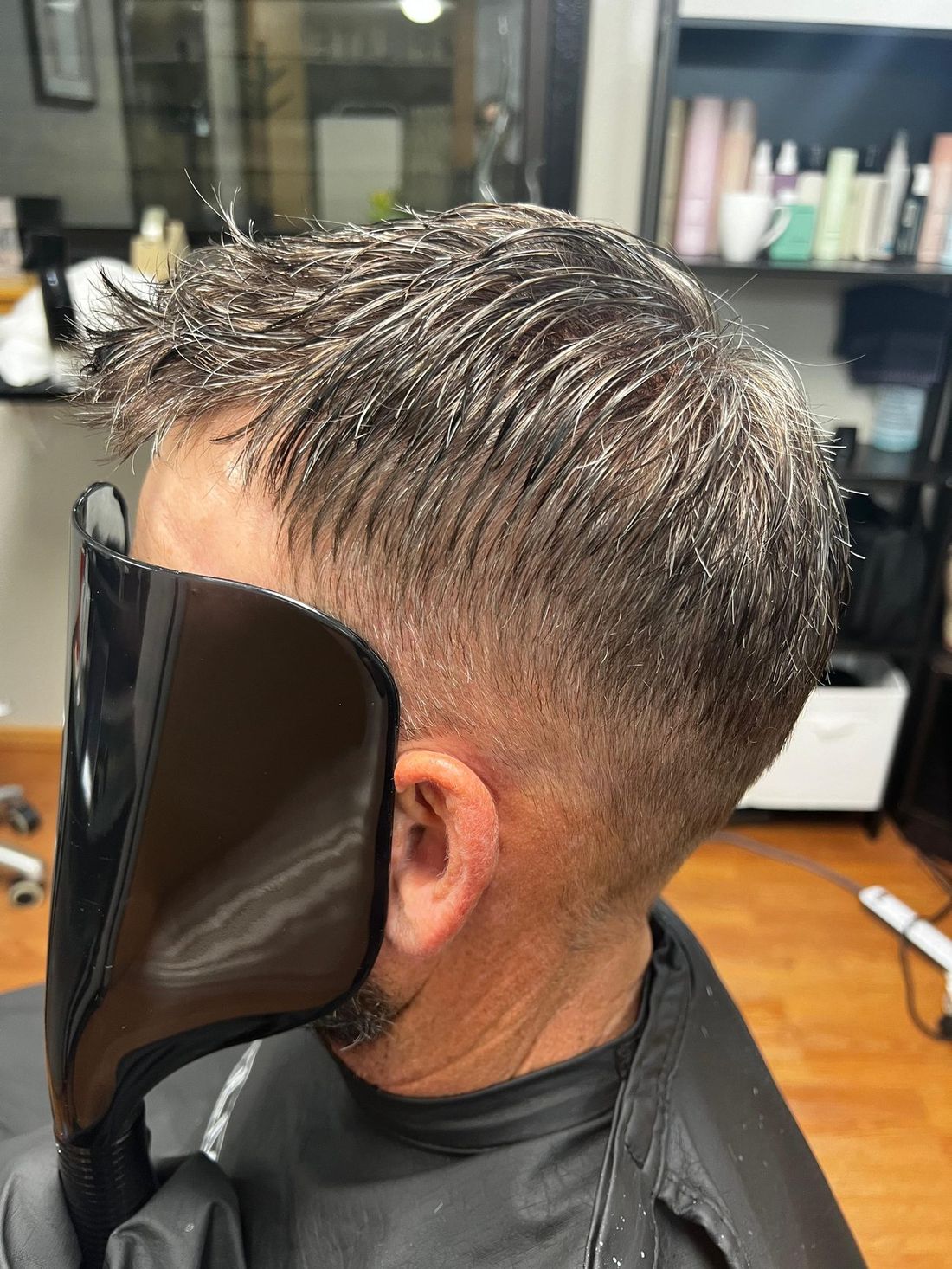 The same side view after a hair replacement system was fitted and blended